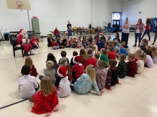 Santa reading to students